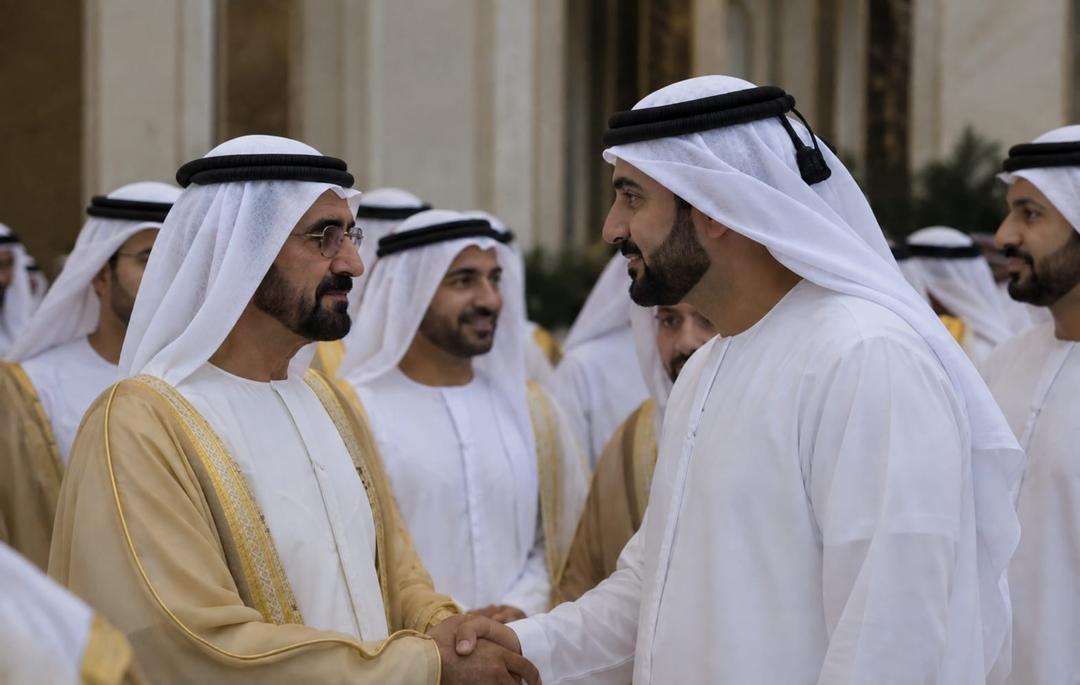 Men in traditional Emirati attire in conversation